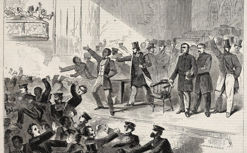 A black and white wood engraving print of an abolitionist meeting in Tremont Temple in Boston, MA on December 3, 1860. Frederick Douglass, a Black man, wears long pants, a waistcoat, and a long coat on the stage in the center of the image. He stands with one hand on his hip and the other out-raised, his mouth open as he speaks back to an unruly crowd at the lower left and in the background around the stage. Officers attempt to quell the crowd in the bottom center of the image. A white man on stage steps towards Douglass and has his hand on Douglass's shoulder. Other white men stand on stage looking at the crowd. On the far right midground, a white man with a beard in a top hat, long pants, and knee-length coat has his left hand in his pocket and his right hand up. In the upper left of the image, three women in bonnets fight on a jutting balcony.